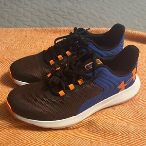 Youth Under Armour Black and Blue Sneakers with Orange Highlights